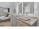Ensuite bathroom boasts double vanity, granite countertops, and square vessel sinks with modern faucets at 237 Ivey Ter # 41, Temple, GA 30179