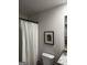 This bathroom features a shower with a white waffle shower curtain and white toilet at 237 Ivey Ter # 41, Temple, GA 30179