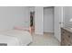 A tidy bedroom with a pink spindle bed and a dresser with a mirror that complements the space at 237 Ivey Ter # 41, Temple, GA 30179