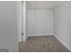Walk-in closet offering ample storage space with a top shelf and carpet flooring at 237 Ivey Ter # 41, Temple, GA 30179