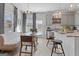 Bright dining area with modern chandelier, banquette seating, and easy access to the kitchen at 237 Ivey Ter # 41, Temple, GA 30179