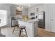Modern kitchen with stainless steel appliances, a center island, and ample counter space for cooking at 237 Ivey Ter # 41, Temple, GA 30179