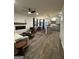 An open floor plan shows the living room with fireplace and the kitchen with modern gray cabinets at 237 Ivey Ter # 41, Temple, GA 30179