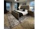 Bright primary bedroom featuring a plush bed, accent rug and three large windows at 237 Ivey Ter # 41, Temple, GA 30179