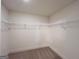 Spacious walk in closet with shelving and carpeted floor at 1910 Victoria Way # 120, Conyers, GA 30013