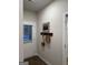 Inviting entryway with a wooden coat rack, stylish decor, and a charming white front door at 243 Ivey Ter # 43, Temple, GA 30179