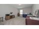 Bright room with neutral carpet, a window, and a display table set up at 2851 Fareed St, Douglasville, GA 30135