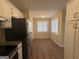 Kitchen offers stainless steel appliances, granite countertops, and natural light, creating an efficient cooking space at 6220 Grovener Ave, Douglasville, GA 30134