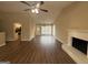 Spacious living room boasts wood floors, fireplace, abundant natural light, creating a cozy and inviting atmosphere at 6220 Grovener Ave, Douglasville, GA 30134