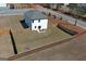 Aerial view of a backyard featuring a patio area and a fence, ideal for privacy and relaxation at 301 Amsterdam Way, Hampton, GA 30228