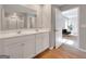 View from a bathroom into a bedroom, showcasing the vanity, shower, and natural light at 301 Amsterdam Way, Hampton, GA 30228