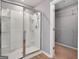 Bathroom features a glass-enclosed shower and convenient access to a walk-in closet at 301 Amsterdam Way, Hampton, GA 30228