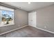 Well-lit bedroom with soft carpet, a double door closet, and a bright window with pleasant views at 301 Amsterdam Way, Hampton, GA 30228