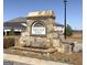 Stone community entrance sign with 'Heritage Point' inscription; welcoming feature at 301 Amsterdam Way, Hampton, GA 30228