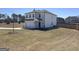 Two-story home featuring a white exterior, attached two-car garage, and large front lawn at 301 Amsterdam Way, Hampton, GA 30228