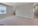 Spacious loft featuring neutral carpeting, freshly painted walls and a bright window at 301 Amsterdam Way, Hampton, GA 30228