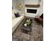 Comfortable living room with a plush sofa, modern fireplace, and stylish decor at 231 Ivey Ter # 47, Temple, GA 30179