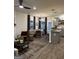 Open concept living room and kitchen with hardwood floors and modern gray kitchen cabinets at 231 Ivey Ter # 47, Temple, GA 30179