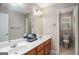 Clean bathroom with double sinks and a mirror over the vanity at 9800 Ivey Ridge Cir, Jonesboro, GA 30238