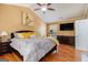 Relaxing main bedroom with a king bed, ceiling fan, and a wall-mounted television at 9800 Ivey Ridge Cir, Jonesboro, GA 30238