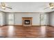 Bright, airy living room featuring hardwood floors, a cozy fireplace, and soft, natural lighting at 195 Willow Way, Stockbridge, GA 30281