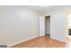 This neutral bedroom has wood-look floors, a closet and neutral walls at 3821 Rex Mill Sq, Rex, GA 30273