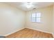 A cozy bedroom with hardwood floors and natural light from the window at 3821 Rex Mill Sq, Rex, GA 30273