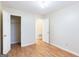 This neutral bedroom has wood-look floors, a closet and neutral walls at 3821 Rex Mill Sq, Rex, GA 30273