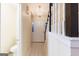 Hallway view with staircase and chandelier leading to the front door at 3821 Rex Mill Sq, Rex, GA 30273
