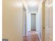 A well-lit hallway with hardwood floors at 3821 Rex Mill Sq, Rex, GA 30273