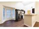 Bright and airy kitchen with stainless steel appliances, dark wood cabinets, and eat-in breakfast bar at 3821 Rex Mill Sq, Rex, GA 30273