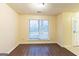 Sunny living room featuring wood-look floors and bright natural light at 3821 Rex Mill Sq, Rex, GA 30273