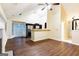 Spacious living room with vaulted ceilings, fireplace, wood floors, and open-concept kitchen with stainless steel appliances at 3821 Rex Mill Sq, Rex, GA 30273