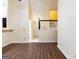 Hardwood-style floors in living room show open layout to front entry and stairway at 3821 Rex Mill Sq, Rex, GA 30273