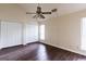 This bedroom features vaulted ceilings, two closets, wood-look floors, and a ceiling fan at 3821 Rex Mill Sq, Rex, GA 30273