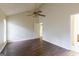 This primary bedroom has vaulted ceilings, wood-look floors, and a ceiling fan at 3821 Rex Mill Sq, Rex, GA 30273