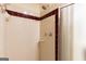 A bathroom shower featuring tiled walls and a glass door at 3821 Rex Mill Sq, Rex, GA 30273