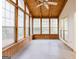 This spacious sunroom features a ceiling fan, tiled floor and lots of bright, natural light at 3821 Rex Mill Sq, Rex, GA 30273
