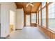 Inviting sunroom with a ceiling fan, tiled floor, and multiple windows showcasing backyard at 3821 Rex Mill Sq, Rex, GA 30273