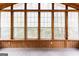 Bright sunroom with large windows offering serene views and wood paneled accents at 3821 Rex Mill Sq, Rex, GA 30273
