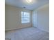Bright bedroom with neutral walls and plush carpet, ready for your personal touch at 440 Cottonpatch Rd, Lawrenceville, GA 30046
