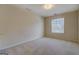 Cozy bedroom featuring neutral walls, carpet, and a window bringing in lots of natural light at 440 Cottonpatch Rd, Lawrenceville, GA 30046