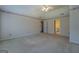 Generous bedroom space with neutral walls and carpets, featuring vaulted ceilings, wallpaper border, and multiple entryways at 440 Cottonpatch Rd, Lawrenceville, GA 30046