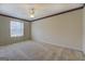 Neutral bedroom with carpet, window, ceiling fan and patterned accent border at 440 Cottonpatch Rd, Lawrenceville, GA 30046