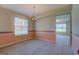 Charming dining room with natural light, a decorative chandelier, and an adjacent space at 440 Cottonpatch Rd, Lawrenceville, GA 30046