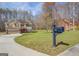 Charming two-story home with a well-manicured front yard and a convenient attached garage at 440 Cottonpatch Rd, Lawrenceville, GA 30046