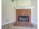 Living room brick fireplace with white mantle and hearth, adding warmth and character to the space at 440 Cottonpatch Rd, Lawrenceville, GA 30046