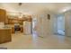 Well-lit kitchen with wood cabinets, white appliances, and an adjacent dining area at 440 Cottonpatch Rd, Lawrenceville, GA 30046