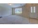 Spacious living room with carpet, natural light, neutral walls, and an entryway at 440 Cottonpatch Rd, Lawrenceville, GA 30046