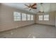Bright sunroom with wood-paneling, ceiling fans, and multiple windows, creating a cheerful and airy space at 440 Cottonpatch Rd, Lawrenceville, GA 30046